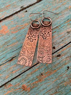 Rustic Hammered Copper Earrings|Handmade Copper Earrings|Antiqued Texturized Artisan Earrings|Boho, Hippie Dangle Earrings Lovely and lightweight bare copper rustic dangle earrings (pics 1-4), hand sawn, texturized, polished and oxidized. Ear wires made of pure commercial grade A hypo-allergenic Titanium, 20 gauge, excellent for sensitive ears. Length is approximately 2  1/4 " (58 mm) and width is slightly over  1/2 " (14 mm) at the widest point. Antiqued, hand-polished for warm aged look and se Bohemian Etched Copper Earrings, Artistic Silver-colored Copper Earrings, Artistic Silver Copper Earrings, Artisan Etched Dangle Earrings, Bohemian Etched Brass Earrings, Bohemian Etched Drop Earrings, Bohemian Drop Earrings With Etched Details, Festival Silver Copper Earrings, Bohemian Etched Metal Earrings