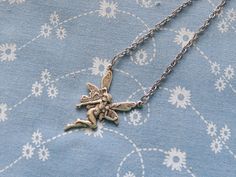 This necklace features an antique plated fairy charm which measures 3.5 x 2.3 cm in size.  This hangs from a 46 cm antique plated chain. Avaliable in antique brass or antique silver plate. Happy shopping! oxo Fairy Pendant, Fairy Charms, Fairy Jewelry, Antique Plates, 2024 Style, Neon Aesthetic, Antique Pendant, Jewelry Inspo, Christmas Wishlist