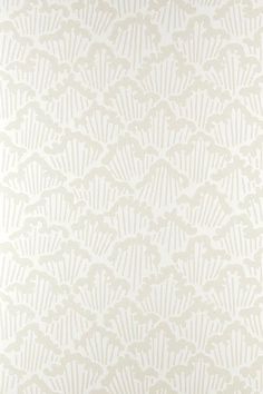 a white and beige wallpaper with an intricate design on the back side of it