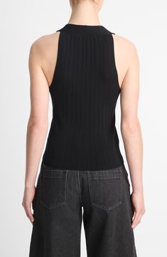 Designed to wear by itself, this ribbed cotton sweater-vest shows off your shoulders—and a bit more if you go with an unbuttoned look. 23" length (size medium) Front button closure V-neck Cutaway shoulders 100% cotton Hand wash, dry flat Imported Ribbed Vest For Fall, Black Turtleneck Tank Top For Spring, Classic Black Tank Top, Chic Fitted Tops With Ribbed Collar, Fitted Black Ribbed Vest, Classic Fitted Sweater Vest For Summer, Classic Black Sweater Vest For Spring, Chic Ribbed Turtleneck Tank Top, Modern Fitted Black Vest