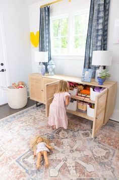 Our playroom area (off of the living room) has been a pain point for us since we moved into our house. It’s right off of our kitchen, dining room, and living room and very central on our first floor… which makes it a perfect space for the kids to play while I’m cooking meals or […] Toy Room In Living Room, Neutral Play Area Living Room, Dining Room Toy Room, Play Area Corner In Living Room, Sophisticated Playroom Ideas, Playroom Nook In Living Room, Loft Toy Room Playroom Ideas, Playroom Elementary Age, Dinning Room Turned Playroom