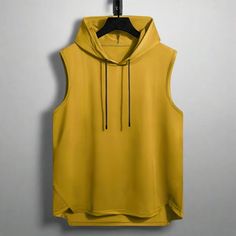 Level Up Your Workout Gear: Quick-Dry Sleeveless Hoodie Take your workouts to the next level with this functional and stylish sleeveless hoodie. Featuring a quick-dry polyester blend, it keeps you cool and dry during even the most intense activities. Performance-Ready: The quick-dry fabric wicks away moisture and dries fast, keeping you comfortable during exercise. Unrestricted Movement: The sleeveless design allows for full range of motion, perfect for any workout. Hooded Style: The attached ho Yellow Hoodie, Hoodie Green, Sleeveless Hoodie, Active Hoodie, Red Green Yellow, Red Hoodie, Mens Accessories Fashion, Bahrain, Kuwait