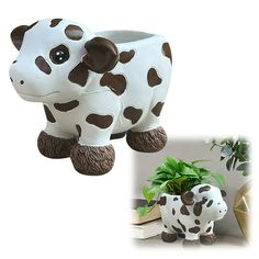 a cow planter sitting next to a potted plant