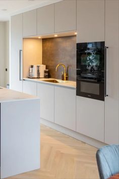 a kitchen with an oven, sink and counter top in it's center island