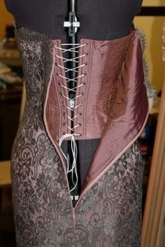 the corset is attached to a mannequin