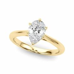 a yellow gold engagement ring with a pear shaped diamond in the center, on a white background