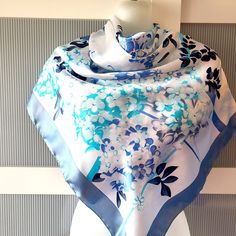 Beautiful and elegant blue silk satin scarf with a gorgeous floral design of cherry and lilac blossom. The scarf combines various shades of blue -  baby blue, powder blue and navy blue on a white background. The scarf has a beautiful sheen. The scarf is large square and can be used as a neck wrap, head cover. hair tie, headband, bag decor, etc. The scarf is marked Kevser Collection. It is in excellent/mint condition and will make a beautiful gift for any occasion! The scarf comes in a gift wrap and with a 'Thank you' card. For more scarves in my store visit: https://www.etsy.com/ca/shop/NostalgicByLiliya?ref=seller-platform-mcnav&section_id=25031148 For other items visit: https://nostalgicbyliliya.etsy.com Cover Hair, Lilac Blossom, Wrap Headband, Spring Dresses Women, Satin Scarf, Spring Accessories, Tie Headband, Lilac Flowers, Flowers Design