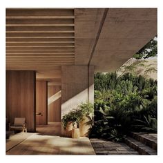 the interior of a modern house with wood and plants