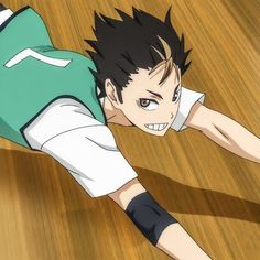 an anime character is laying on the floor