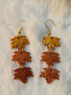 Embrace the beauty of autumn with these stunning Fall Leaves Resin Earrings! Carefully handcrafted, these earrings capture the vibrant hues of fall, in a mesmerizing resin design. Each pair is uniquely created to showcase the essence of fall foliage, making them a perfect accessory for the season. These lightweight earrings dangle gracefully, catching the light with every movement, adding a touch of seasonal charm to any outfit. Whether you're enjoying a cozy day at the pumpkin patch, a brisk wa Leaf-shaped Brown Earrings Gift, Brown Leaf-shaped Earrings For Gift, Brown Leaf-shaped Earrings Gift, Orange Earrings For Fall Season Gift, Fall Orange Earrings As Gift, Handmade Multicolor Jewelry For Fall, Handmade Brown Leaf-shaped Jewelry, Fall Season Gift Dangle Earrings, Brown Jewelry For Fall Season Gift