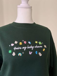 Fully embroidered design on a super cozy sweatshirt, perfect for St. Patty's festivities!  Unisex, True to size Lucky Charms Embroidery, Cute Embroidered Long Sleeve Sweatshirt, Cute Long Sleeve Embroidered Sweatshirt, Cute Crew Neck Sweatshirt With Embroidered Text, Cute Embroidered Sweatshirt For Winter, Cute Green Sweatshirt For Winter, Cute Green Winter Sweatshirt, Cute Crew Neck Sweater With Custom Embroidery, Cute Embroidered Sweatshirt For Fall