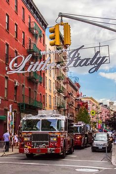 firetrucks are parked on the side of the street