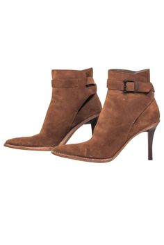 Step out in downtown style with Gucci's suede booties! Crafted with luxurious suede and a leather lining for a cushy fit, these booties add a subtly sophisticated edge to any ensemble. Elevate your look with a pair of these booties, perfect for pairing with a suede jacket for a truly killer look! Size 6 (IT 36) Made in Italy 100% Suede Rubber sole Skinny heel Outer ankle buckle closure Minor blemishes on suede and heel Heel height 4" Shaft 5" High Ankle Suede Booties For Fall, Fitted Suede Booties For Fall, Chic Suede Boots Medium Width, Winter Suede Boots With Reinforced Heel, Chic Almond Toe Boots With Suede Lining, Fitted Leather Winter Booties, Suede Ankle-high Booties, Suede Boots With Suede Lining For Fall, Fall Suede Heeled Boots With Reinforced Heel