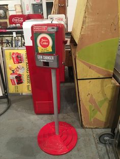 a coca cola machine sitting on top of a floor