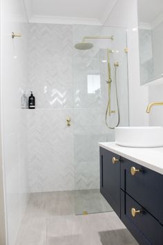 a bathroom with a shower, sink and mirror