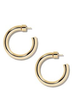 Refine everyday looks with the high-polish shine of these hoop earrings. 1" diameter; 1/4" width Post back 14k-gold plate Imported Small Gold-tone Polished Hoop Earrings, Small Gold-tone Hoop Earrings With Polished Finish, Chic Polished Round Hoop Earrings, Chic Polished Finish Round Hoop Earrings, Chic Polished Small Hoop Jewelry, Chic Small Hoop Jewelry With Polished Finish, Modern Gold-tone Hoop Earrings, Classic Hoop Jewelry With Gold-tone Hardware, Everyday Elegant Earrings With Gold-tone Hardware