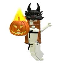 a lego figure holding a lit pumpkin with a black cat on it's back