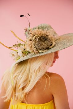 Feel fabulous in the sun with this sun hat featuring a blue and gold color scheme, white flowers with a green stem, and a unique bird nest design. Perfect for a day at the races or any outdoor event. This hat is ONE OF A KIND, created by our owner Stephanie. To receive item quicker, expedited shipping is available at checkout. Green Fedora Straw Hat For Kentucky Derby, Green Straw Hat With Curved Brim For Garden Party, Green Brimmed Straw Hat For Garden Party, Green Curved Brim Straw Hat For Garden Party, Green Wide Brim Straw Hat For Garden Party, Green Straw Hat For Kentucky Derby Vacation, Green Straw Hat With Curved Brim For Spring, Green Curved Brim Straw Hat For Spring, Kentucky Derby Straw Hat With Structured Crown