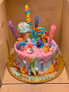 a birthday cake in a box with candy and candies