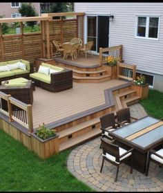 an outdoor deck and patio with seating area