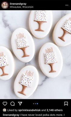 four decorated cookies with hair combs on them