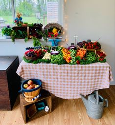 Lots of colorful veggies and fruit. Dip in carved cabbage. Little things about Peter Rabbit sitting around. Peter Rabbit Charcuterie Board, Peter Rabitt Baby Shower Ideas, Peter Rabbit Party Food, Peter The Rabbit Baby Shower Theme, Locally Grown Baby Shower Theme, Peter Rabbit Baby Shower Ideas, Mr Mcgregors Garden, Nesting Party, Bunny Baby Shower Theme