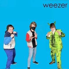 three people in costumes with the words weezer written on them and one person wearing a face mask