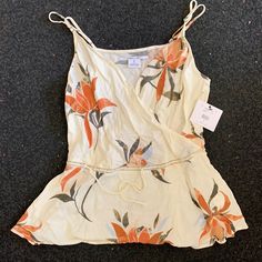 Super Cute Off White Tank With Flower Pattern. 100% Rayon, Very Flowy And Soft. New With Tags. Floral Print Tops For Beach Season Day Out, Beachy Cotton Tank Top, Chic Floral Print Tank Top For Beach, Tropical Sleeveless Tops With Floral Print, Beachy Tops With Tropical Print For Spring, Tropical Sleeveless Floral Print Top, Beachy Floral Print Top For Vacation, Summer Floral Print Tops For Beach Season, Casual Tropical Print Top For Spring