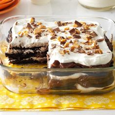 a glass dish filled with cake sitting on top of a table