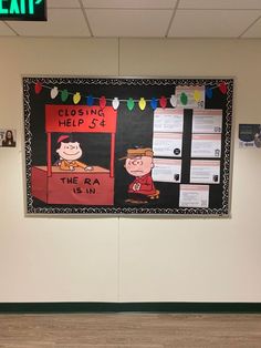 a bulletin board is hanging on the wall