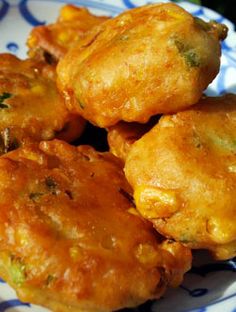 some fried food on a blue and white plate