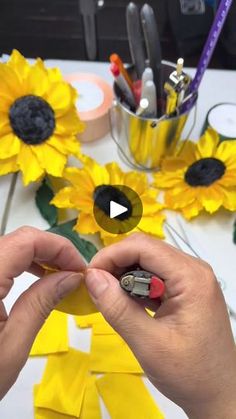 someone is making sunflowers out of construction paper