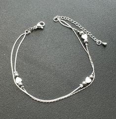 Small hearts 925 starling silver plated foot chain, Ankle bracelet. Size: Silver: 20cm + 5cm Gold: 21cm + 5cm Gift bag including Dainty Silver Anklet With Adjustable Chain, Silver Anklets With Adjustable Chain As Gift, Adjustable Hypoallergenic Silver Anklet, Silver Adjustable Heart-shaped Anklets, Adjustable Silver Heart Anklets, Silver Heart-shaped Anklets As Gift, Dainty Silver Heart Anklets, Ankle Bracelets Gold, Anklet Silver