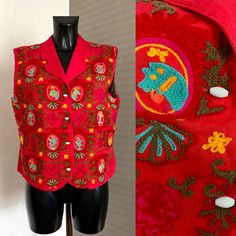 "Vintage Unisex Bright Red Embroidered Vest Etnic Neon Floral Vest Waistcoat Formal Romantic Hippie Hipster Festival Collared Vest Size M/L ♥ Unisex Collared Vest ♥ Embroidered Floral, Dracon, Tee Cup ♥ 4 Yellow Snail Lid button up ♥ Check Green Cotton Lining ♥ Waistband on Back ♥ 2 Small Pockets on front Condition: Vintage condition : Excellent Tag: Oilily Materials: 100% Cotton Size: 40 (Fits on M/L) Measurements: Length : 55cm = 21,7\" Width: 104cm = 41\" **Measurements are taken with the garment lying flat. (Some sizes then doubled - Bust, Waist, Hips). Be sure to leave room for movement and comfort** Additional Notes: Please note that due to the nature of vintage clothing, ALL ITEMS ARE SOLD AS-IS; with no returns or exchanges, regardless of fit or condition. We try our best to give a Vintage Red Outerwear With Floral Embroidery, Red Vintage Outerwear With Floral Embroidery, Vintage Red Embroidered Outerwear, Red Folk Style Spring Outerwear, Fitted Red Embroidered Outerwear, Red Embroidered Sleeveless Vest, Embroidered Sleeveless Outerwear For Winter, Red Floral Embroidered Outerwear, Red Vest For Fall Festival