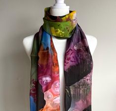 This periwinkle, green, pink, and white scarf in silk or poly chiffon features a tie dye pattern inspired by one of my one of a kind paintings.  * Two Fabric Options: Silk Habotai, and Poly Chiffon * Two sizes: 10" x 45" and 16" x 72" Made from 100% polyester fabric or silk * Very soft hand, lovely drape * Print is visible about 50% on the back side * Each scarf is printed and sewn by hand in Montreal, Canada * Vivid print that will never fade after washing * Machine wash in cold water with phosphate free detergent, hang to dry, iron on synthetic setting, may shrink after the first wash Silk Habotai: delicate yet durable accessories, this item features a reactive printed 100% silk scarf, available in silk habotai, featuring my artwork. The unique reactive print process means the print will Purple Scarves As Summer Gifts, Pink Hand-dyed Scarf, Bohemian Hand-dyed Scarves For Spring, Bohemian Hand Dyed Spring Scarves, Bohemian Hand Dyed Scarves For Spring, Summer Multicolor Shawl As Gift, Multicolor Summer Shawl As Gift, Summer Hand-dyed Tie-dye Scarves, Summer Hand Dyed Tie Dye Scarves