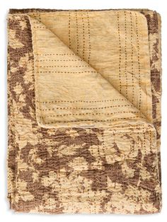 a brown and beige blanket with an intricate design