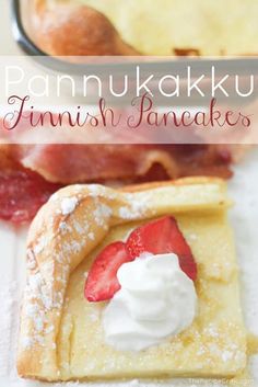 pannulakki finnish pancakes with whipped cream and strawberries on the top are ready to be eaten