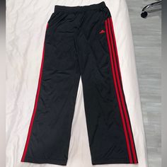 Has Pockets Colors: Black And Red Size: Xl Condition: New Without Tags Adidas Red Cotton Pants, Casual Red Pants With Three Stripes, Black Adidas Cotton Sweatpants, Black Cotton Adidas Sweatpants, Adidas Black Sweatpants For Sports, Adidas Black Sportswear Sweatpants, Adidas Black Sporty Pants, Adidas Black Cotton Sweatpants, Adidas Bottoms