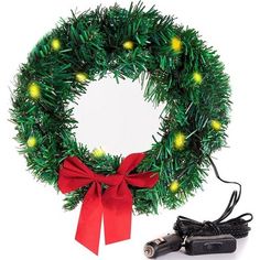 a christmas wreath with lights on it and a charger attached to the front of it