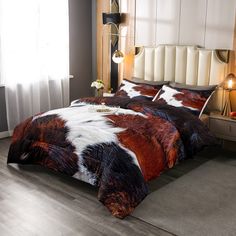 a bedroom with a bed covered in brown and white fur