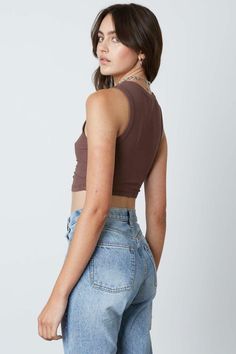 Final Sale - Get it before it's gone! Upgrade your basic wardrobe in the Next Level Chestnut Brown Cinched Cropped Tank! Soft and stretchy ribbed knit shapes a cropped tank silhouette with a crew neckline, a sleeveless bodice, and cinched detail on hem. DETAILS & CARE Rayon/Spandex. Machine wash cold. Imported. Brown Sleeveless Cotton Crop Top, Cheap Brown Tank Crop Top, Brown Cropped Tank Top, Brown Cotton Short Sleeve Crop Top, Cropped Brown Cotton Tank Top, Brown Tank Top, Basic Wardrobe, Boho Pink, Chestnut Brown