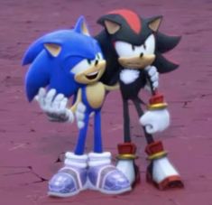 two sonic and tails standing next to each other