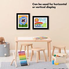 two children's art prints on the wall above a small table and chairs in a child's playroom