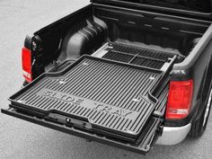 the back end of a pickup truck with its cargo compartment open