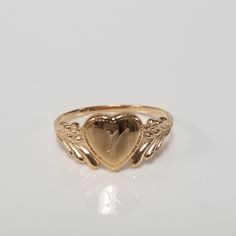 "Thanks for shopping our vintage estate store. We tend to sell well below wholesale and truly hope you enjoy all of our items. Many of the items are one of a kind, so please enjoy scrolling through the pictures and hopefully something will catch your eye. Brown spots are from camera or reflections. Estate 14k yellow gold monogram cursive capital V heart ring. Custom made ring for our shop. Ring size: 3 Setting: 7.5mm 1/4\" to 3/8\" Band width: 1.4mm Weight: .90 gram Marked 14k and it's sweet. On Cursive V, V Heart, Antique Style Rings, Gold Heart Ring, Etsy Gold Ring, Dope Jewelry, Gold Monogram, Initial Ring, Jewelry Lookbook