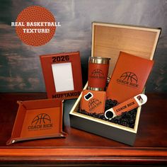 an orange basketball themed gift box with personalized flasks and two lighter holders