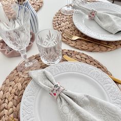 a table set with place settings and napkins