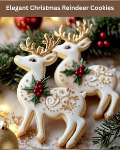 three decorated reindeer cookies sitting on top of a table