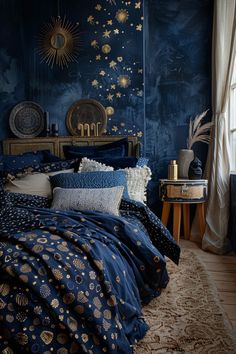 a bedroom with blue walls and gold stars on the wall, along with a large bed