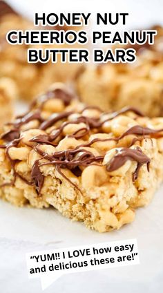 honey nut cheerios peanut butter bars with chocolate drizzled on top and the words, yummy love how easy and delicious these are?